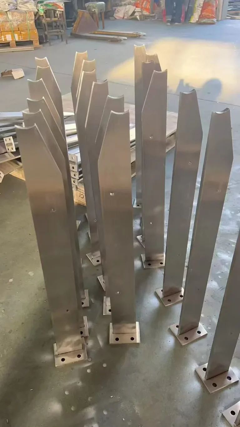 Batch of notched flat-bar stainless steel railing posts with shaped handrail interfaces