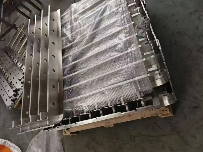 Stainless steel railing posts layered with protective material on an export pallet