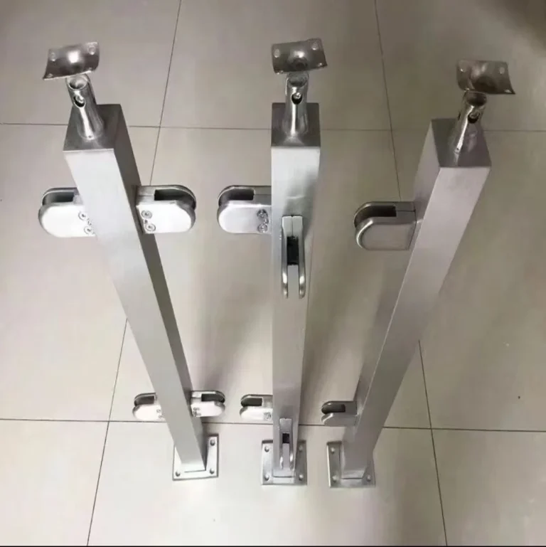 Three square stainless steel railing post first-article variants with different glass-clamp layouts