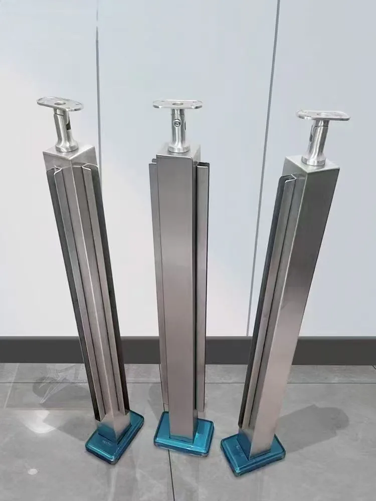 Three square stainless steel railing posts showing straight and angled handrail support orientations