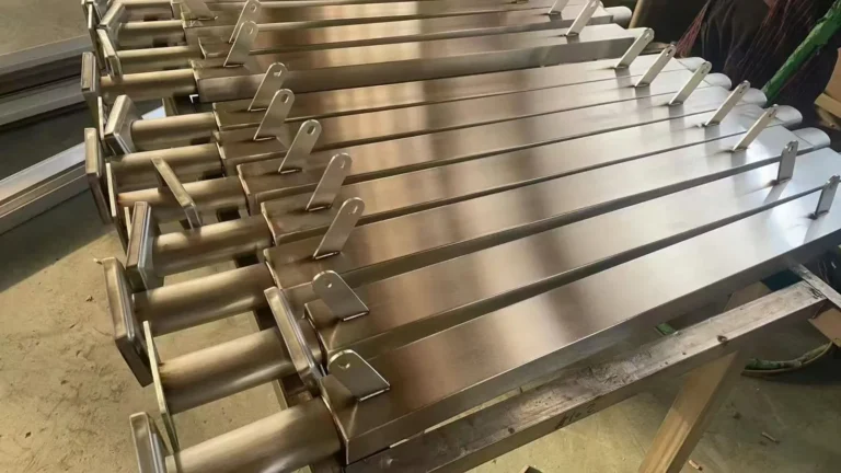 Batch of finished square stainless steel railing posts with welded handrail supports